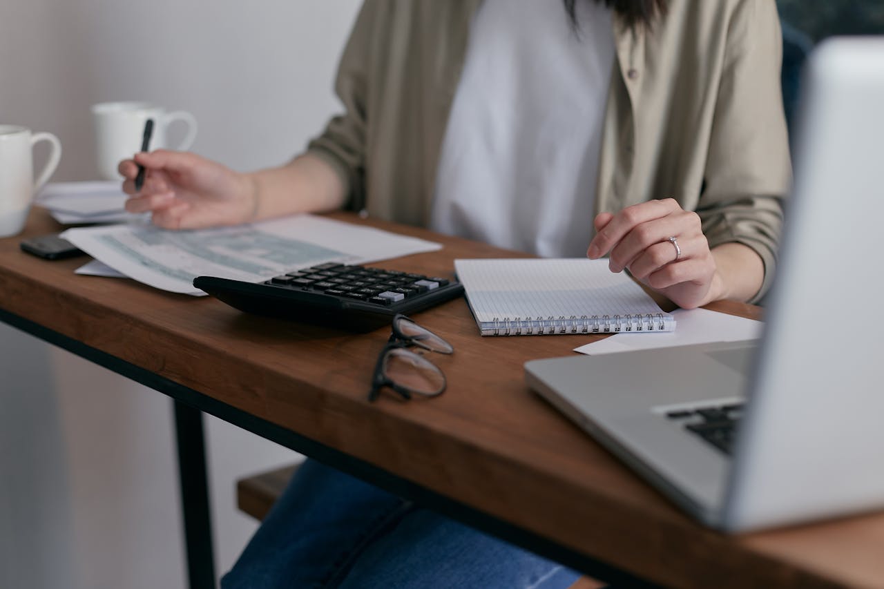 Person at desk working with numbers