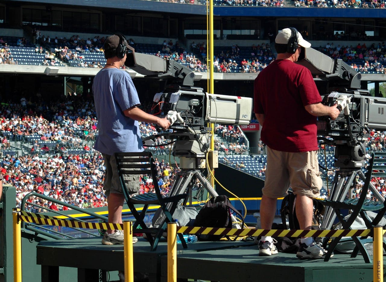 Two cameraman at a sporting event