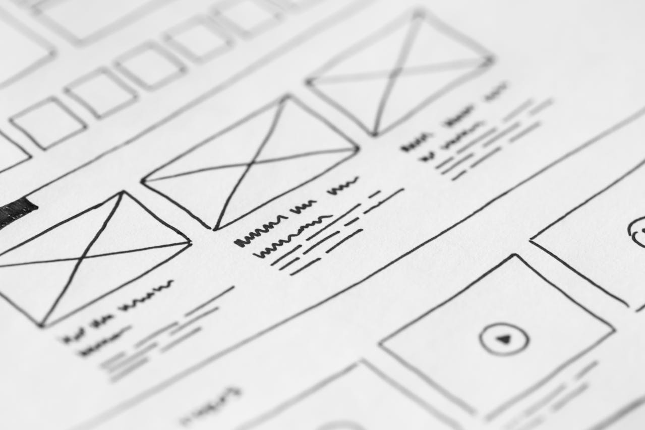 Wireframe drawings depicted on paper