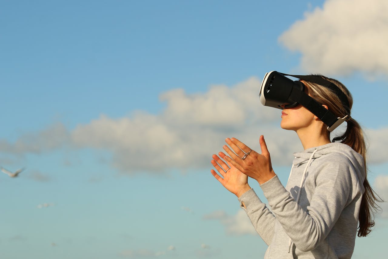 Woman wearing VR goggles looking at the sky