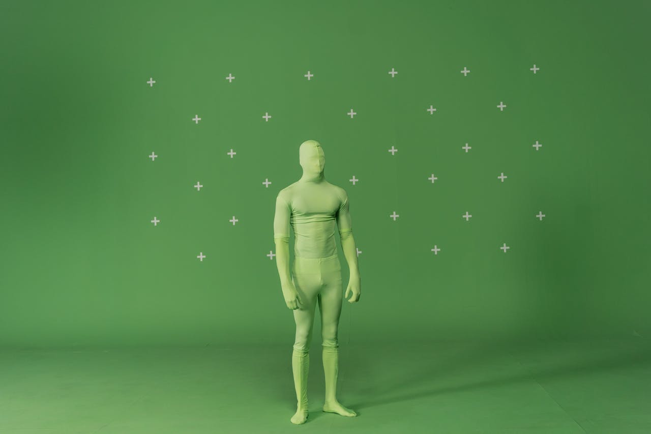 Figure in a green suit with a green screen background