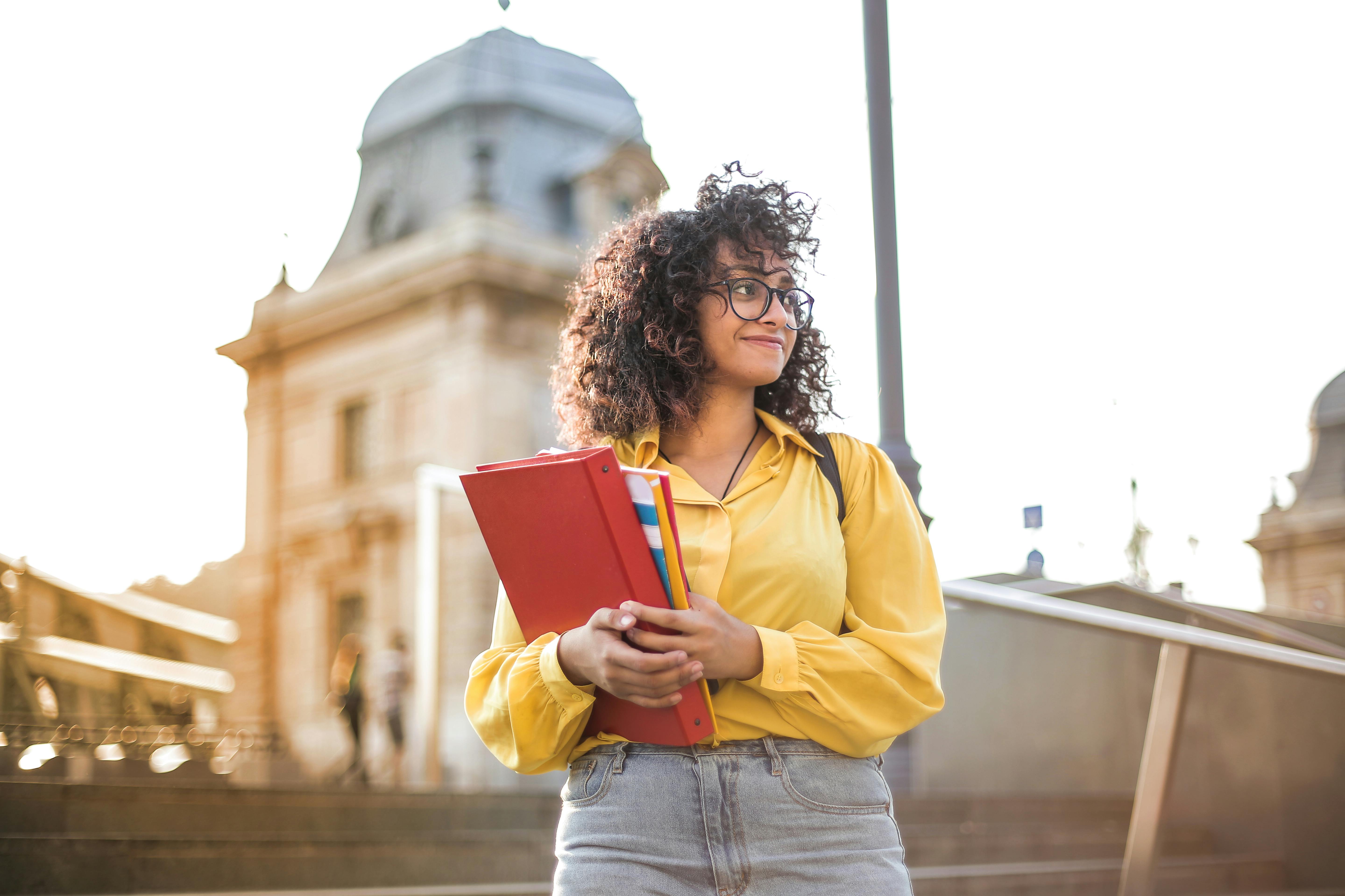 Student in front of building